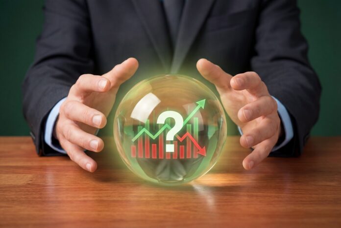 Business hands holding a crystal ball with a financial graph and a question mark inside