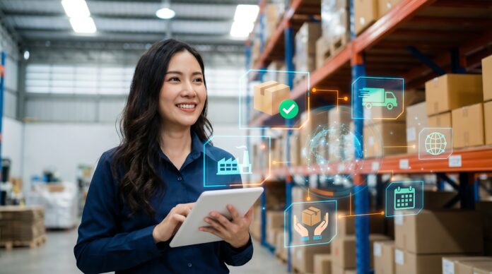 A professional Asian woman smiling while managing complex logistics in a modern warehouse, utilizing a digital tablet and advanced supply chain technology effectively. KI-Förderung der NRW.BANK unterstützt Mittelstand in NRW mit Zuschüssen für die Vorbereitung und Erprobung von KI-Projekten.