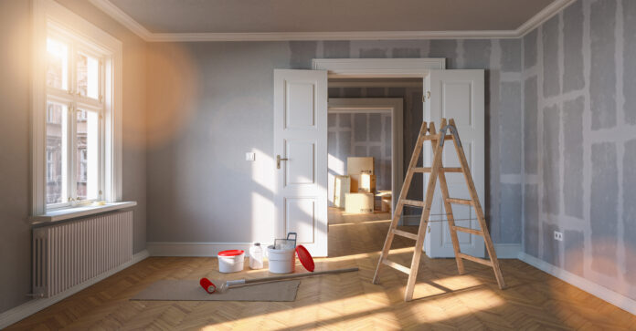 Painting wall gray in room before and after restoration or refur